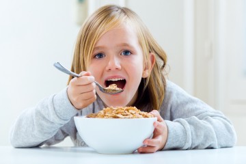 kid girl eating cereal